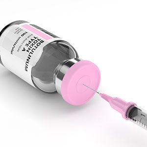 A glass bottle labeled Botulinum toxin type A