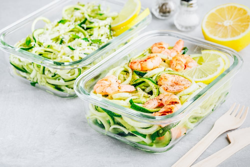Meal prep lunch box containers Spiralized zucchini noodles pasta with shrimps
